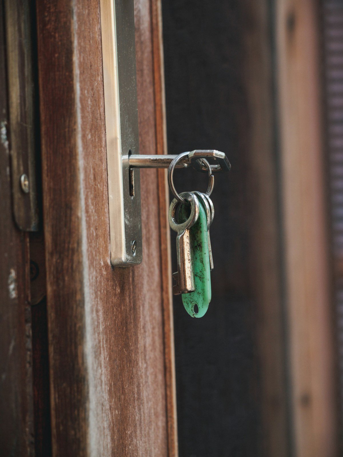 Keys inserted in a wooden door lock